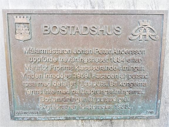 A sign with the history of one of the hotel buildings. The text will follow.